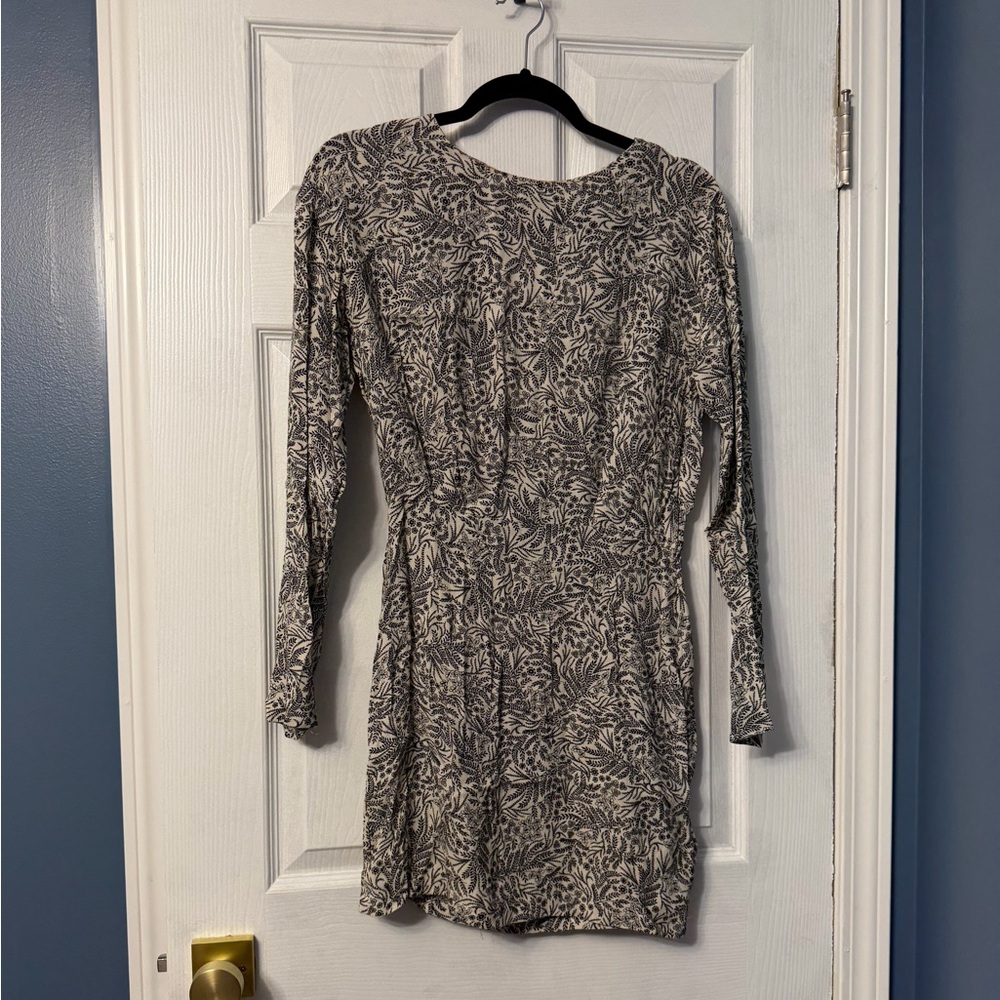 H&M high necked mini dress, with open back size 2. Has tanner on the neckline